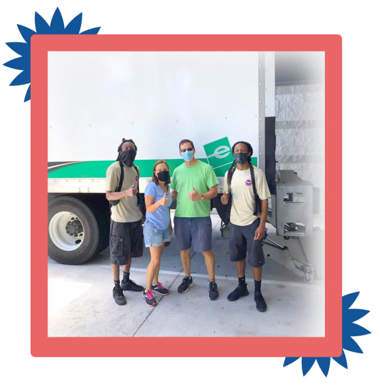 a group of our family moving and storage employees give a thumbs up after a successful move